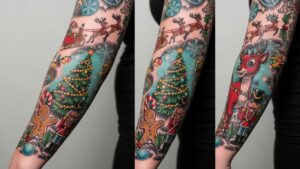 A vibrant full-sleeve tattoo featuring various Christmas icons including a decorated tree, a nutcracker, a gingerbread man, Rudolph the reindeer, and Santa in his sleigh.